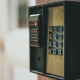 Close-up of a security access control keypad with illuminated buttons for keyless entry.