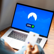 A person using a VPN on a laptop, symbolizing secure internet browsing in a modern indoor setting. A person using a VPN on a laptop, symbolizing secure internet browsing in a modern indoor setting.